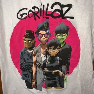 White “Gorillaz” tee.